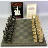 WELSH SLATE CHESS BOARD - with scroll carved border, 43.5cms diameter, together with a 32 piece
