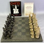 WELSH SLATE CHESS BOARD - with scroll carved border, 43.5cms diameter, together with a 32 piece