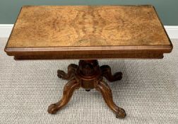 VICTORIAN BURR WALNUT FOLDOVER CARD TABLE - on a carved pedestal four footed base and brass castors,