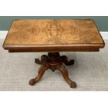 VICTORIAN BURR WALNUT FOLDOVER CARD TABLE - on a carved pedestal four footed base and brass castors,