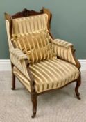 EDWARDIAN WINGBACK ARMCHAIR - with striped upholstery, on cabriole supports and castors, 93cms H,