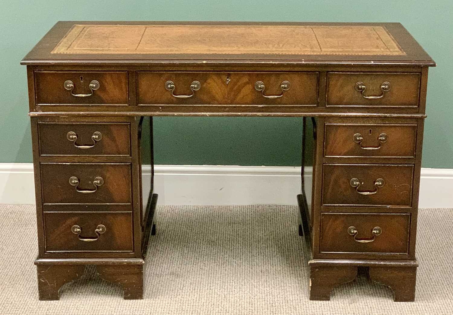 REPRODUCTION MAHOGANY TWIN PEDESTAL DESK - having eight opening drawers with swan neck handles, on