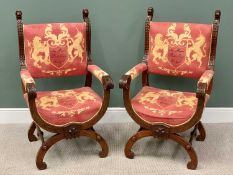 REGAL TYPE ARMCHAIRS - a pair, having "X" framed and arched stretchers, with ornate carvings and