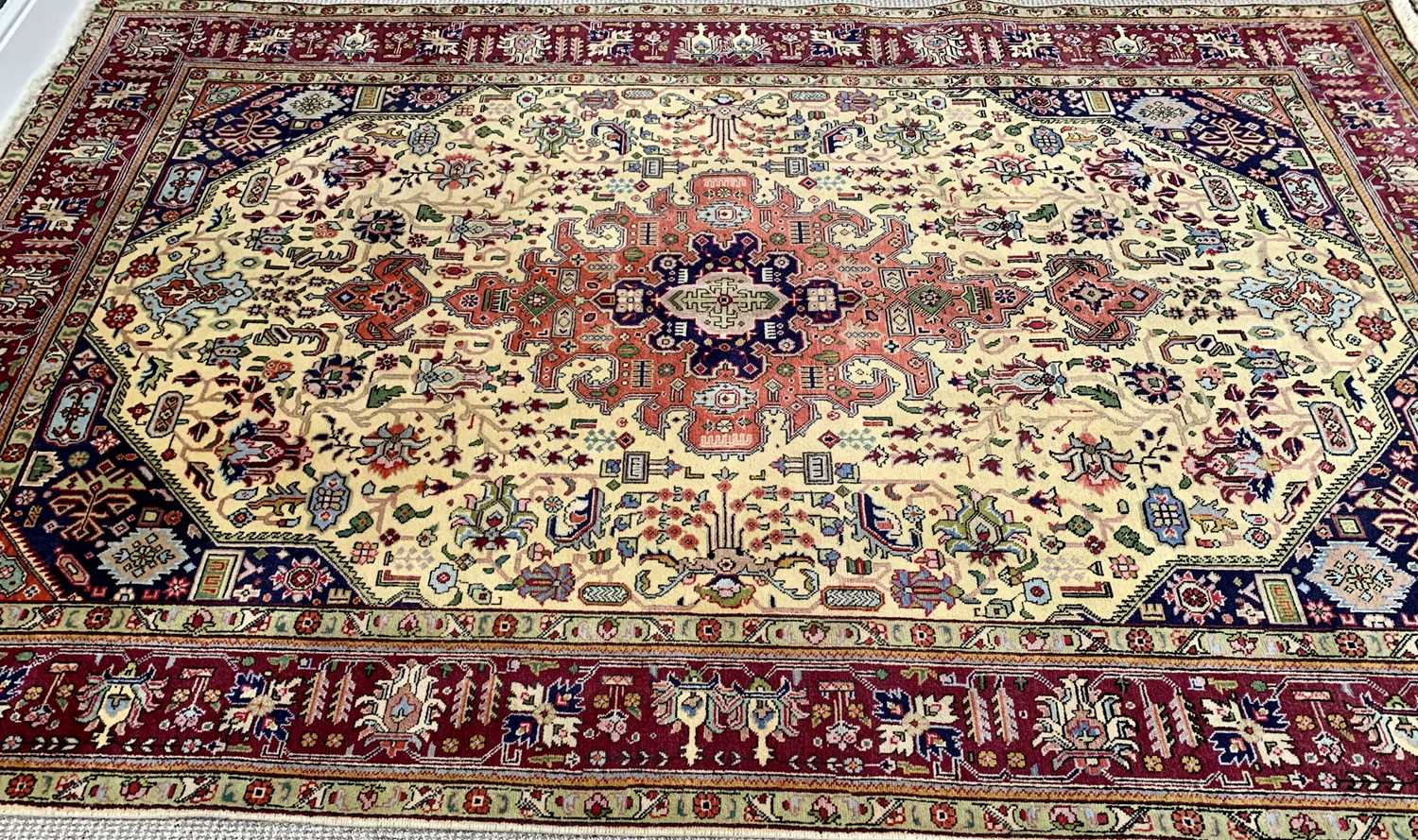 LARGE EASTERN STYLE RUG - multiple bordered with tasselled ends, traditional central motif and - Image 2 of 3