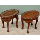 MODERN EASTERN MAHOGANY OVAL SIDE TABLES - a pair, the shaped edge tops with brass inlay and