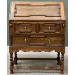 VINTAGE JACOBEAN STYLE OAK FALL FRONT BUREAU - having a fitted interior over two long drawers, on