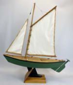 SCALE MODEL SAILING BOAT - of wooden construction, the hull painted green, the keel black, fully