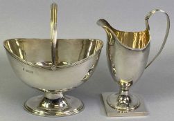 GEORGIAN STYLE HELMET SHAPED CREAM JUG and matching swing handle sugar basket, Birmingham 1976,