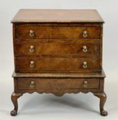 QUEEN ANNE STYLE WALNUT APPRENTICE CHEST ON STAND - rectangular top with molded rim over three