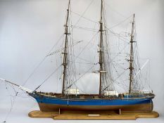 SCALE MODEL THREE MASTED SAILING SHIP - of wooden construction, the hull painted blue and brown,