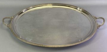 LARGE OVAL SILVER PLATED TWO-HANDLED SERVING TRAY - having beaded edge decoration with chased