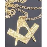 9CT GOLD SECRET MASONIC SQUARE & COMPASSES PENDANT on an unmarked yellow metal necklace, 2.5cms