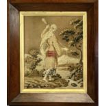 19TH CENTURY NEEDLEWORK TAPESTRY - figure alongside a stream, in a rosewood frame, 58 x 50cms