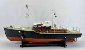 SCALE MODEL MOTORBOAT - the hull painted black and red, with stand, 44cms H, 77cms L