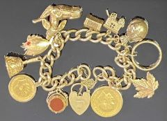 9CT GOLD CHARM BRACELET WITH PADLOCK CLASP & SAFETY CHAIN holding 11 items to include a George V