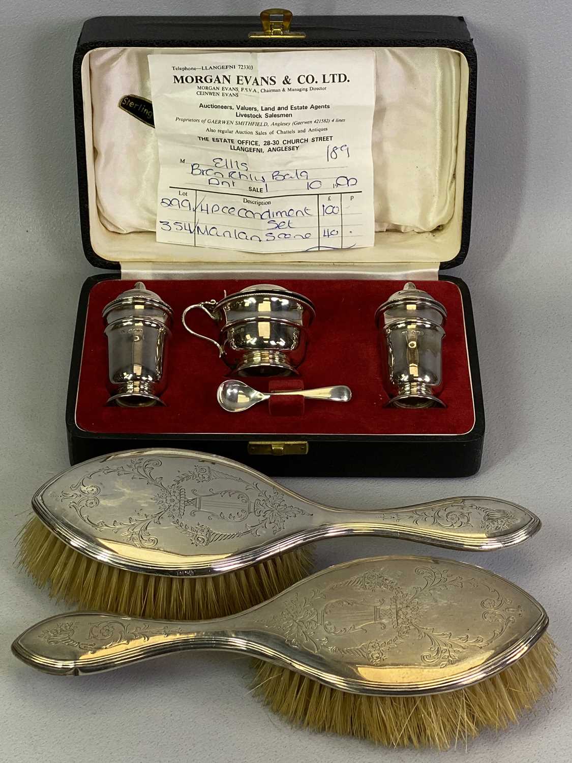 CASED SHEFFIELD SILVER CONDIMENT SET and two Birmingham hallmarked dressing table brushes, the set