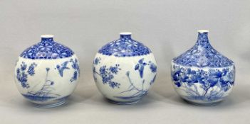 JAPANESE BLUE & WHITE VASES, A PAIR - globular form, decorated with a band of flowers and birds,