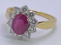 18CT GOLD PINK RUBY & DIAMOND CLUSTER RING - in excess of 1ct facet cut oval central stone, 8 x 6mm,