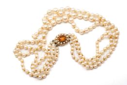 CULTURED PEARL TRIPLE STRAND CHOKER, of grad. pearls 8-4mm to a 9ct pearl & oval cairngorm set