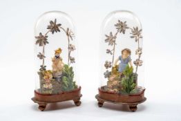 PAIR OF DIORAMAS OF CHILDREN, depicting young girls in naturalistic setting, housed in domed cases