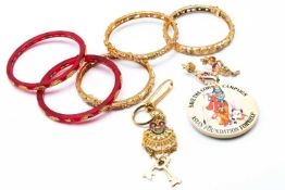 ASSORTED GOLD PLATED JEWELLERY comprising three bangles set with semi-precious stones, pair of