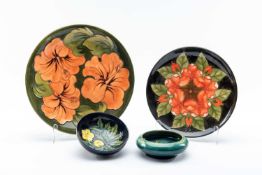 FOUR MOORCROFT POTTERY ITEMS, including prewar small 'Iris' pattern rolled rim bowl, small '