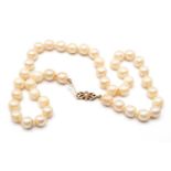 CULTURED PEARL SINGLE STRAND CHOKER, of 8mm pearls to a 9ct gold and seed pearl-set double bow