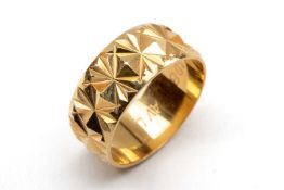 18CT GOLD RING, faceted lozenge relief decoration, ring size O, 5.7gms Provenance: private