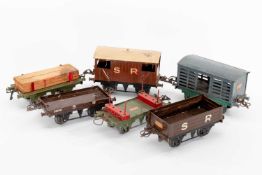 ASSORTED PRE-WAR HORNBY TINPLATE ROLLING STOCK, comprising three Southern Railway wagons, milk