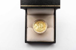 EDWARD VII GOLD HALF SOVEREIGN RING, 1909, set in yellow metal pierced ring mount, ring size N, 9.