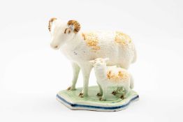 ENGLISH PEARLWARE EWE & LAMB GROUP, c. 1800, modelled as a standing side by side, sponged