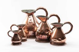 GRADUATED SET OF COPPER HAYSTACK MEASURES, from 25cm to 10cm high (5) Comments: unmarked, dented