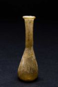 ROMAN GLASS PIRIFORM BOTTLE, 2nd-4th C. AD, with tall neck and everted foldover rim, yellow tinted