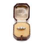 PLATINUM THREE STONE DIAMOND RING, engraved to shank ‘I. McW To M.E.G. 1-3-23’, tot diamond wt.