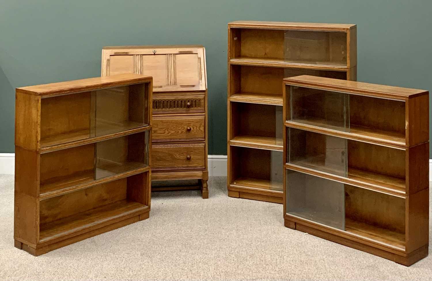 MINTY OAK BOOKCASES (3) - the first having four sections, each having two glazed sliding doors,