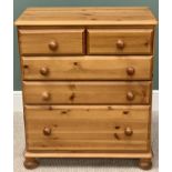 PINE BEDROOM CHEST - rectangular top with moulded edge over two short and three long graduated