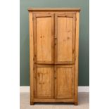 STRIPPED PINE FOUR DOOR CUPBOARD - with moulded cornice, the doors with brass knob handles, 208cms