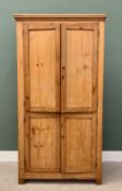 STRIPPED PINE FOUR DOOR CUPBOARD - with moulded cornice, the doors with brass knob handles, 208cms
