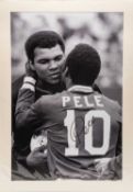 A BLACK & WHITE PRINT OF PELE EMBRACING MUHAMMAD ALI - signed Pelé, together with an A1 Sporting