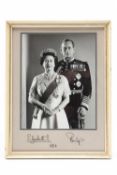 ROYALTY - a black and white photograph of Queen Elizabeth II and Prince Philip, signed and dated