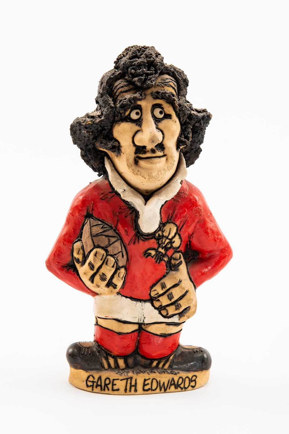 GROGG CARICATURE BY JOHN HUGHES OF GARETH EDWARDS standing on titled base, wearing his Wales No.9