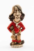 GROGG CARICATURE BY JOHN HUGHES OF JPR WILLIAMS standing on titled base, wearing his Wales No.15