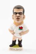 GROGG CARICATURE OF MARTIN JOHNSON (World of Groggs) standing on titled base, wearing his England