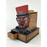 FRENCH NOVELTY CIGARETTE DISPENSER, modelled with large face of a gendarme with open mouth,