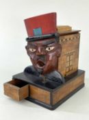 FRENCH NOVELTY CIGARETTE DISPENSER, modelled with large face of a gendarme with open mouth,