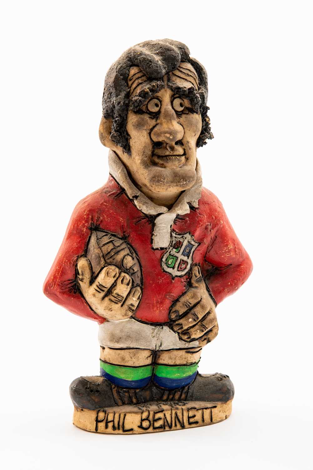 GROGG CARICATURE BY JOHN HUGHES OF PHIL BENNETT standing on titled base, wearing his British Lions