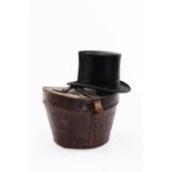 A LINCOLN BENNETT & CO SUPERIOR QUALITY TOP HAT in silk, complete with fitted tan leather case wth