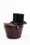 A LINCOLN BENNETT & CO SUPERIOR QUALITY TOP HAT in silk, complete with fitted tan leather case wth