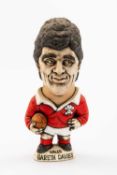 GROGG CARICATURE BY JOHN HUGHES OF GARETH DAVIES standing on titled base, wearing his Wales No.10