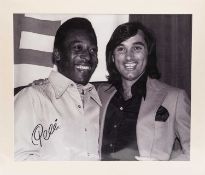 AN ICONIC BLACK & WHITE PHOTOGRAPHIC PRINT image of the late Pelé and the late George Best, signed